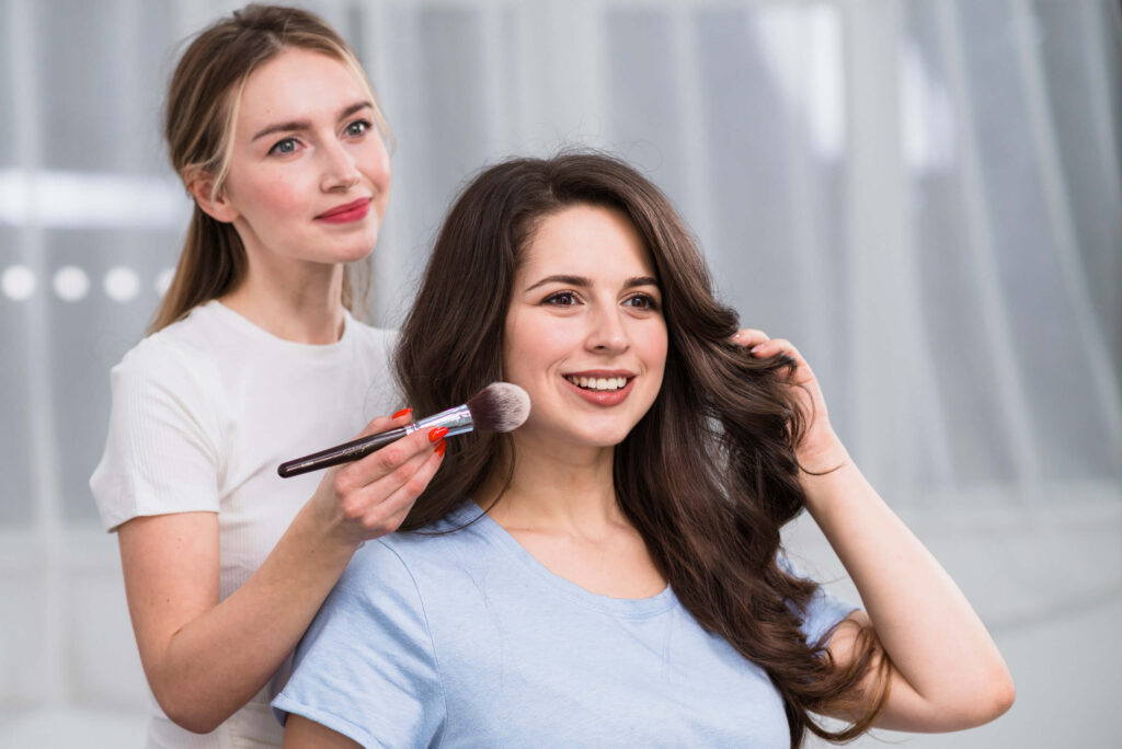 female-visagiste-doing-makeup