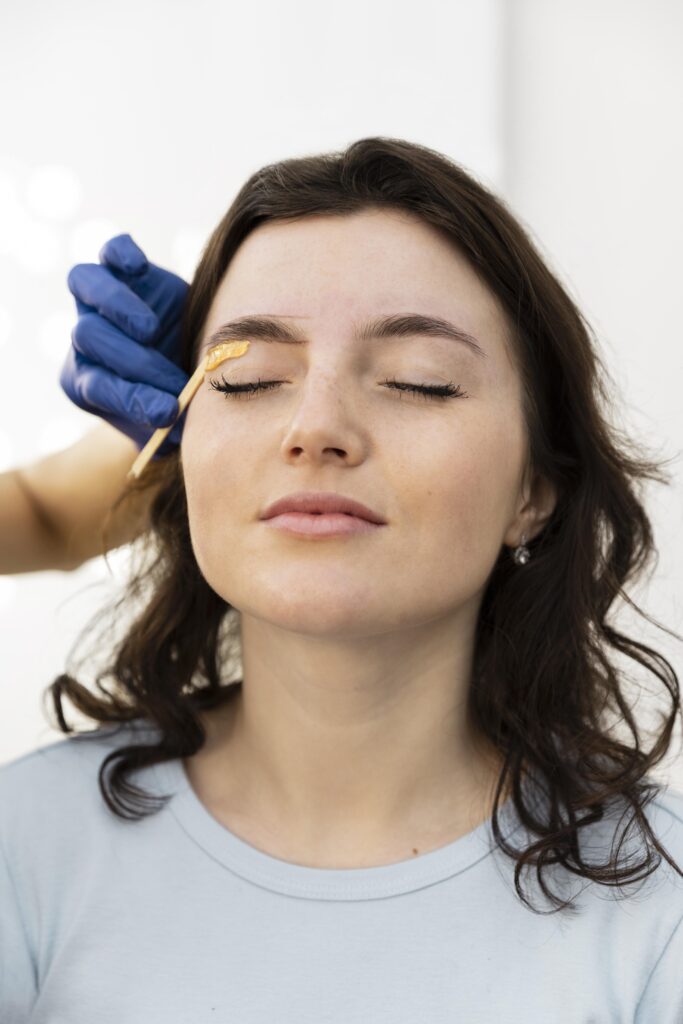 woman-getting-eyebrow-treatment