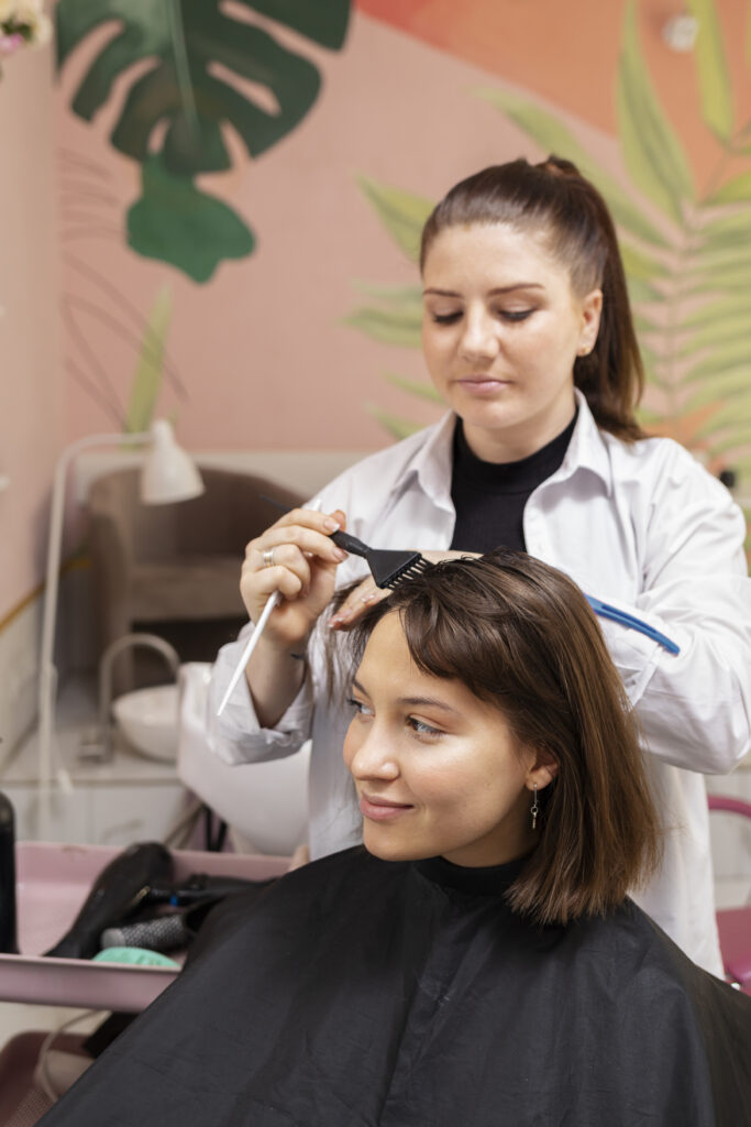 woman-getting-treatment-hairdresser