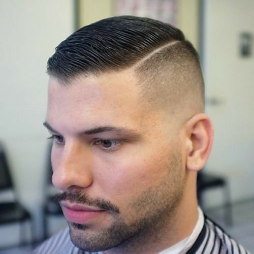 A man with high and tight buzz haircut