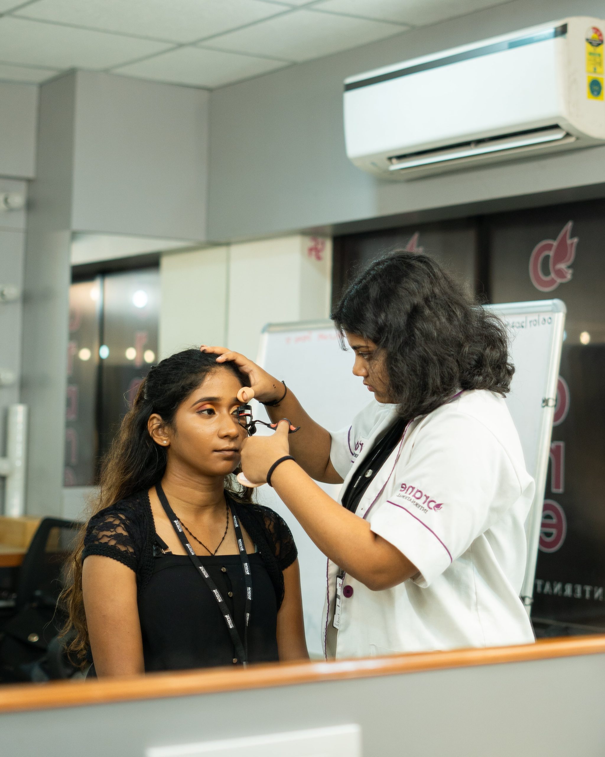 Orane student doing practice makeup