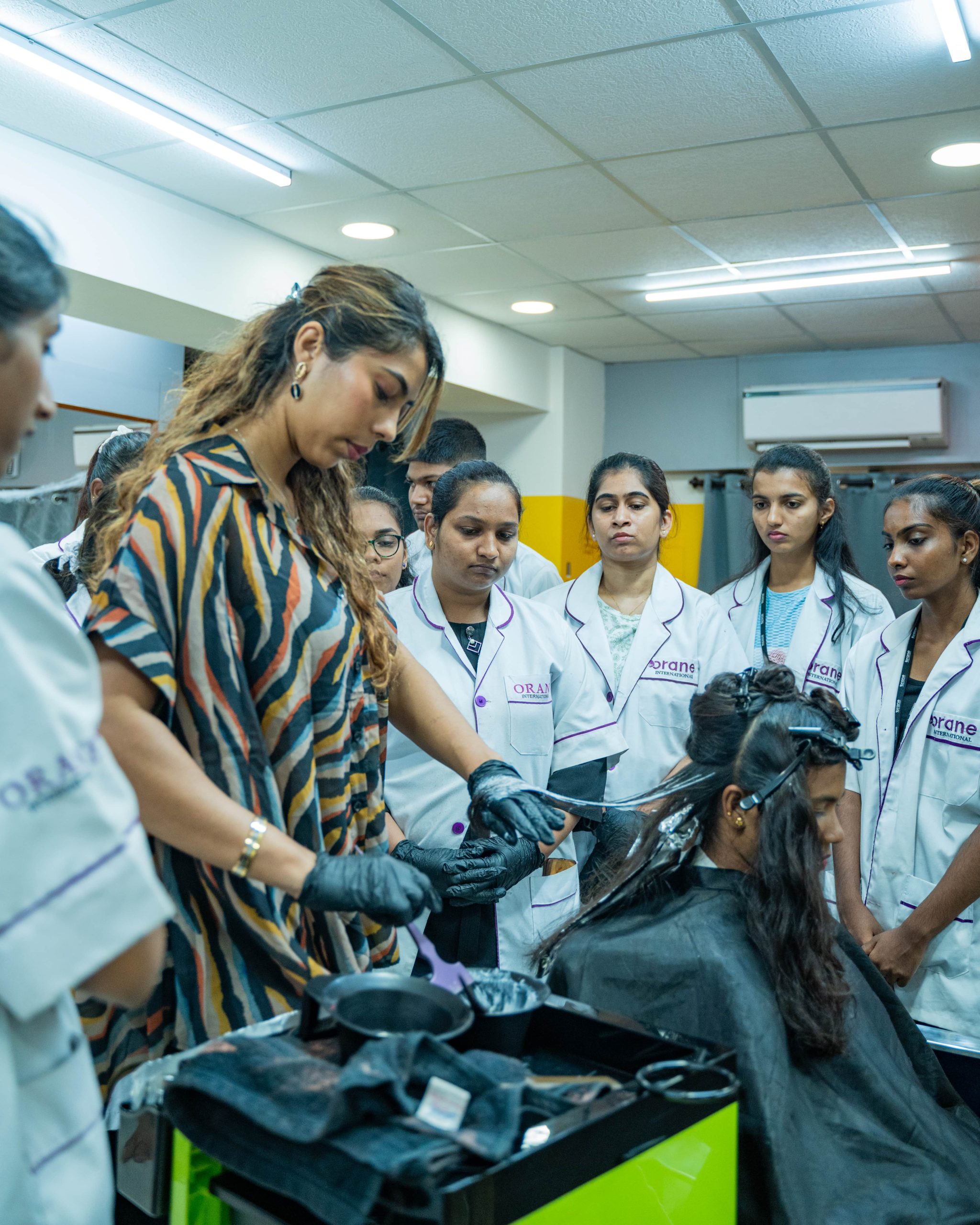 Orane students lean hair styling skills